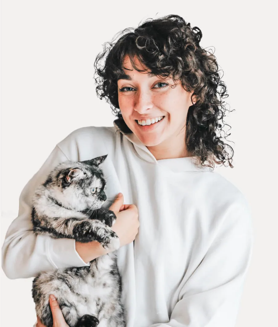 Owner cuddling her cat